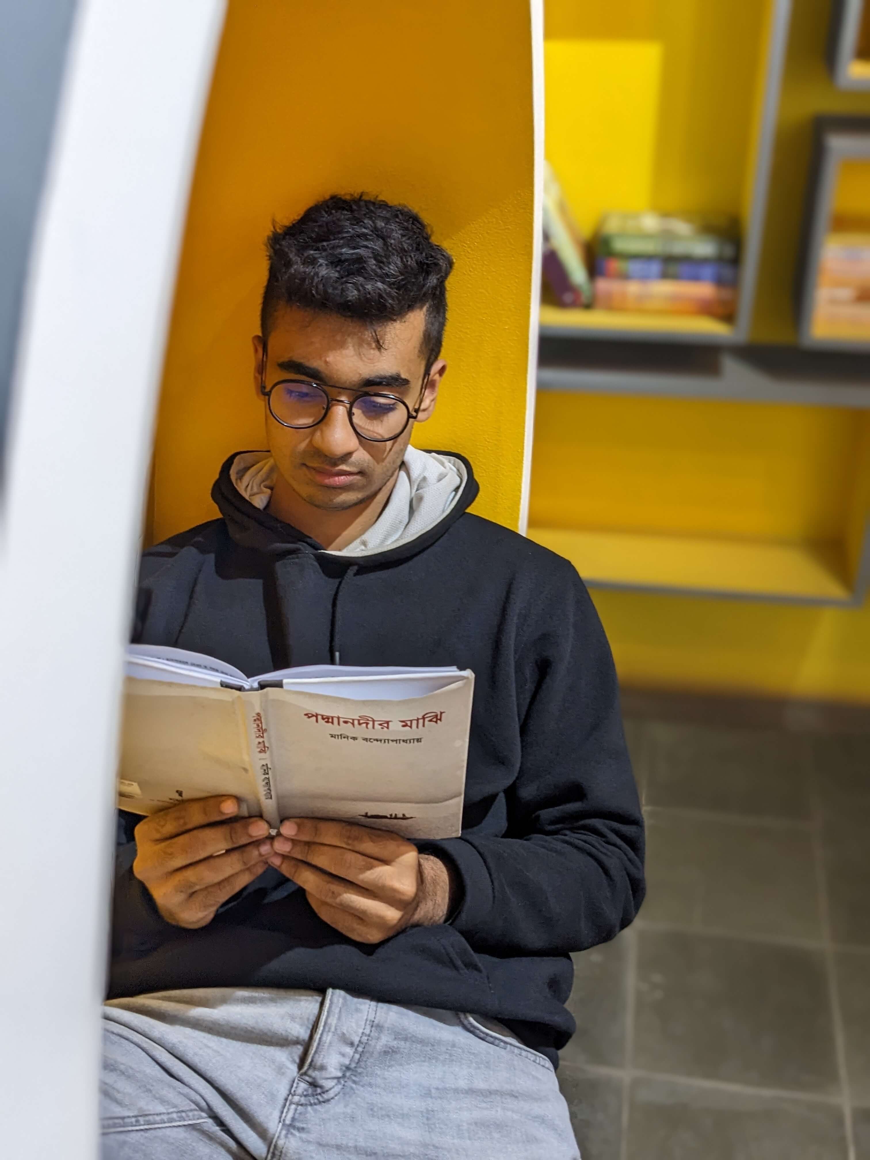 Kamil Hassan reading a book
