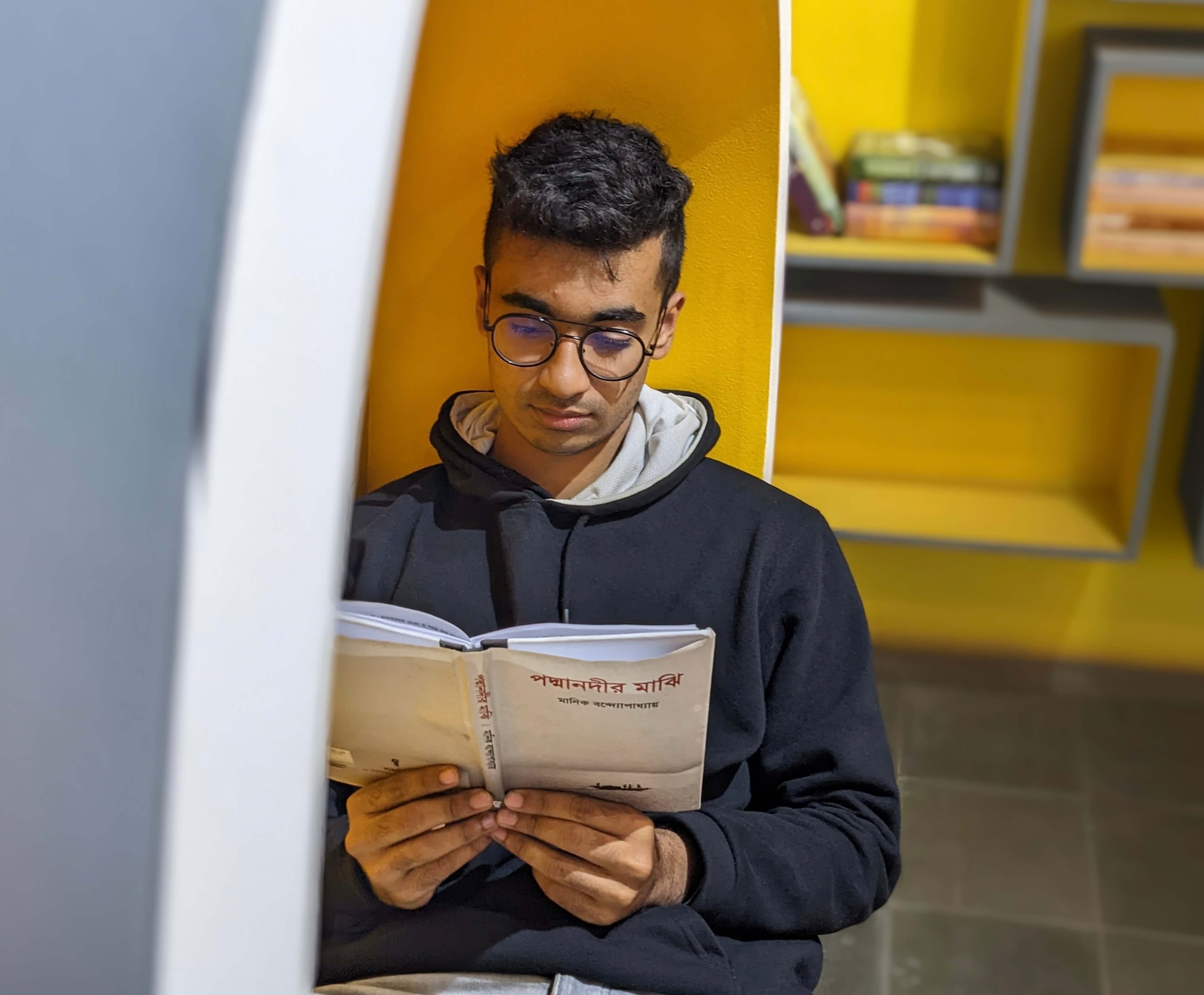 Kamil Hassan reading a book
