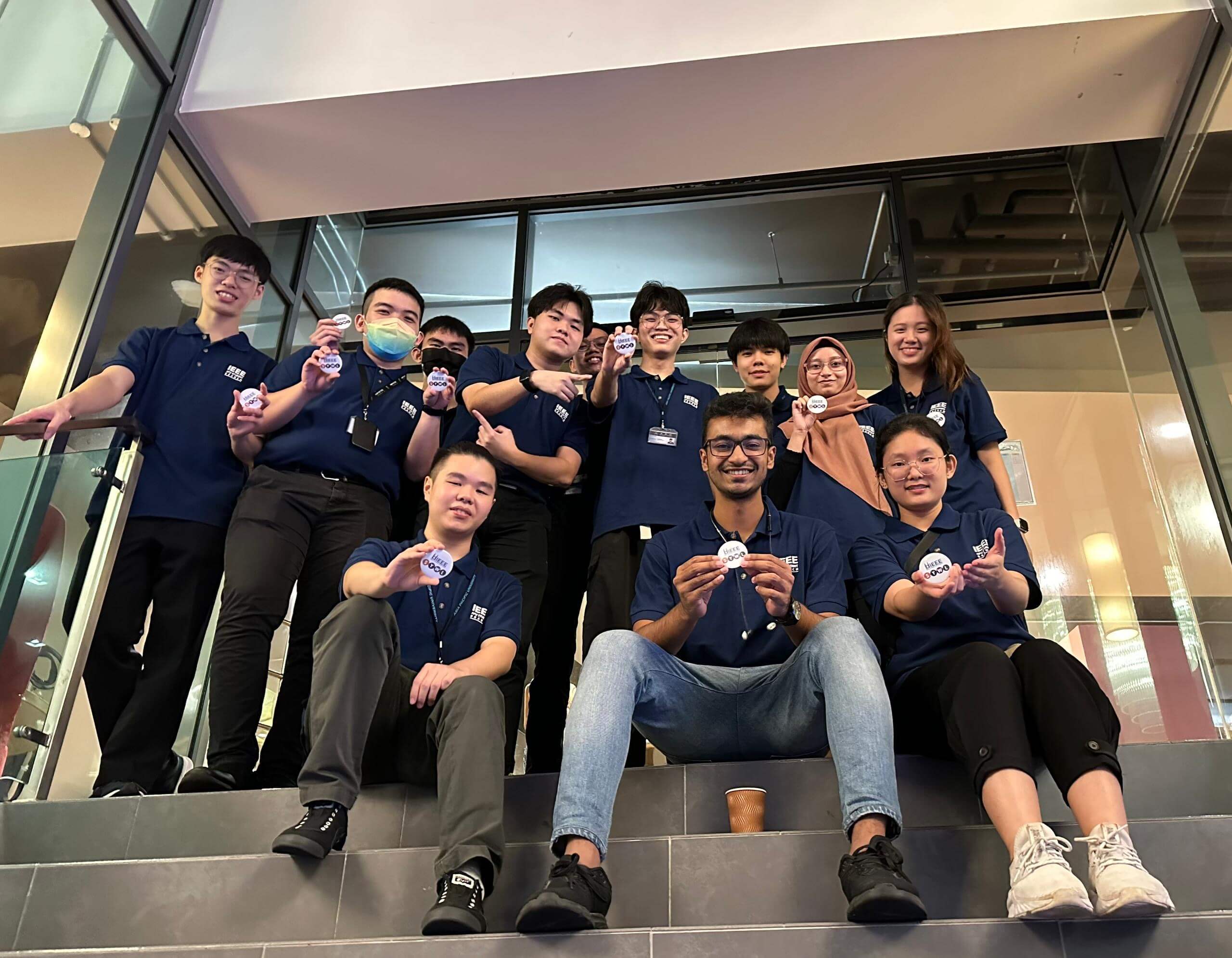 Kamil Hassan with team members at an IEEE event